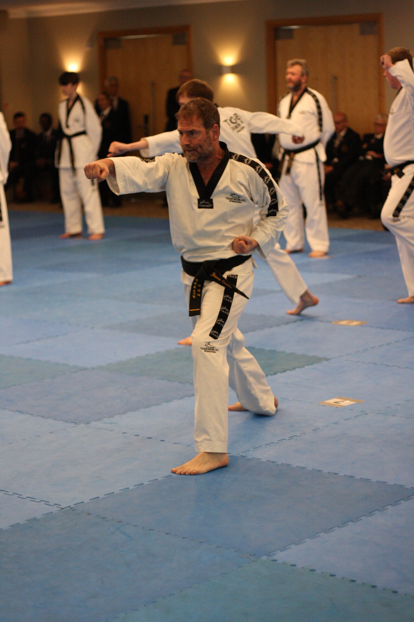 Corsham Tae Kwon Do black belt practising a punching technique during class